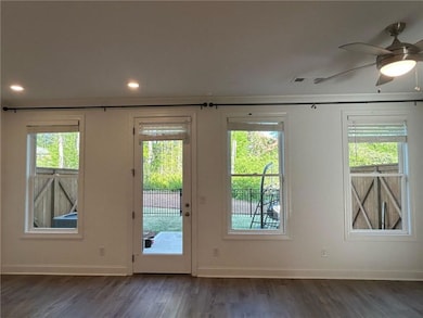 Entryway featuring baseboards, wood finished floor
