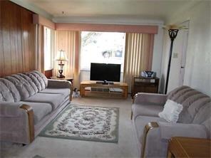 Livingroom with hardwood flooring under the carpet