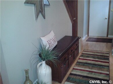 Foyer. nice wide entryway with wood floors and guest closet.