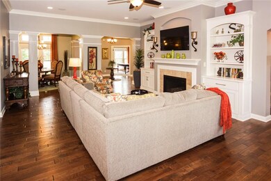 Spacious open main level has beautiful hardwoods, built ins, detailed trim and molding.  