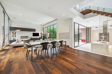 Soaring ceilings and floor-to-ceiling windows welc