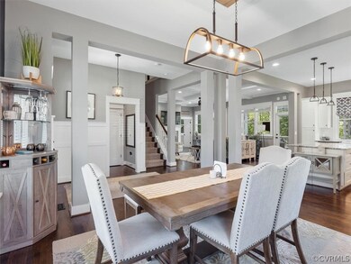 Off of the well appointed entry you’ll find the dining room w/ wainscotting and chandelier w/ decorative framing that is open to kitchen.