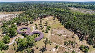 Land offers timber, pastures and flat to rolling t