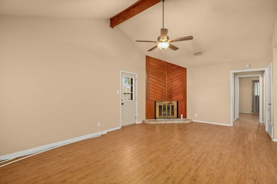 Unfurnished living room with ceiling fan, light w