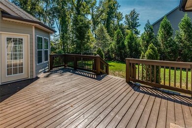 Large rear deck with steps to backyard, profession