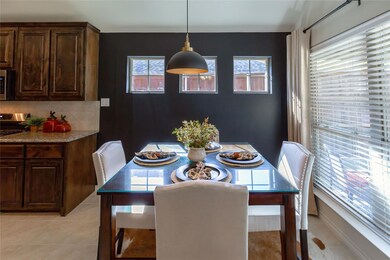 Tiled dining area featuring a healthy amount of su