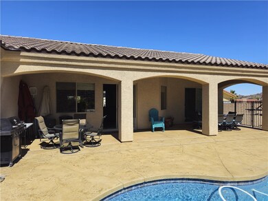 Rear view of property with outdoor dining space, a