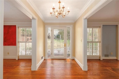 Entryway with visible vents, baseboards, ornamenta