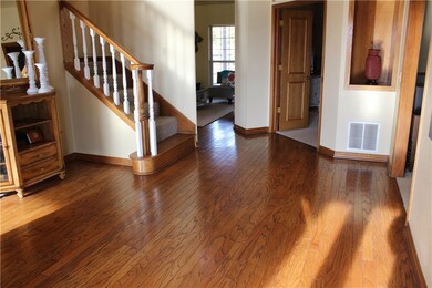 Wood floors that also lead into the double door entry into Master Suite