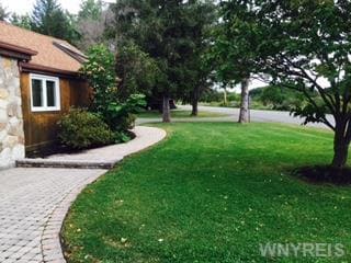 Exterior Front Professionally landscaped on quiet 