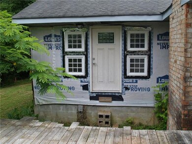 Exterior rear of dwelling. Lacks siding. Deck unfi