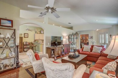 A large archway between the living room and the ki