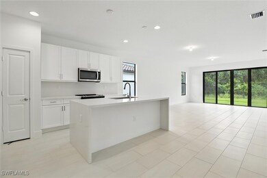 Kitchen with stainless steel microwave, healthy am