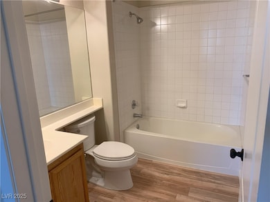 Full bathroom with vanity, toilet,  shower combina
