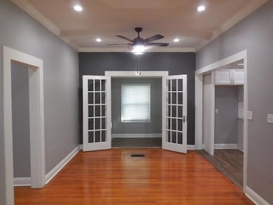 Unfurnished room featuring baseboards, recessed li