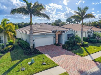 Ranch-style house with a front yard and a garage
