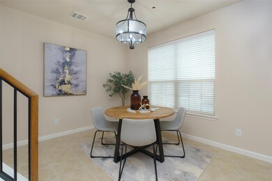 Dining area with visible vents, baseboards, a not