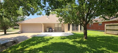 Extended back patio and driveway. Side/back entry garage with opener.  Large back yard with lots of shade.  Shed & partial fence.