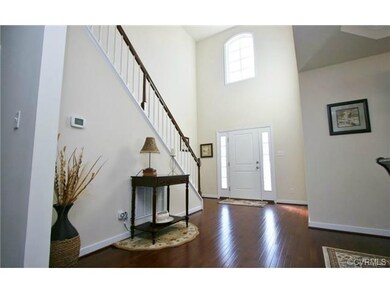 Open Foyer to second level, large formal entryway.