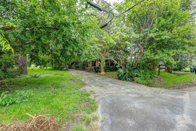 Right side of the easement to the left of the driv