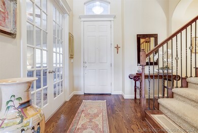 The foyer offers hardwoods that flow to the family
