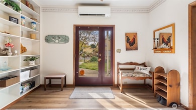 Note the mini-split heating and AC unit above the front door