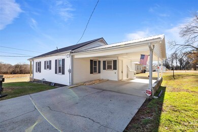 Carport area (stove and lumber will be removed)