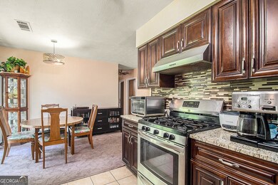 Kitchen is equipped with Granite Countertops, Stai