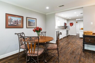 The dining room opens to the galley kitchen.