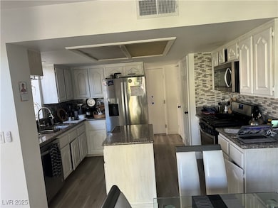 Kitchen featuring appliances with stainless steel