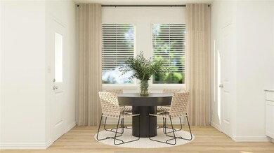 Dining area with light wood-type flooring