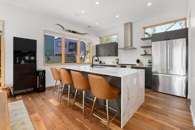 Kitchen featuring open shelves, freestanding refr