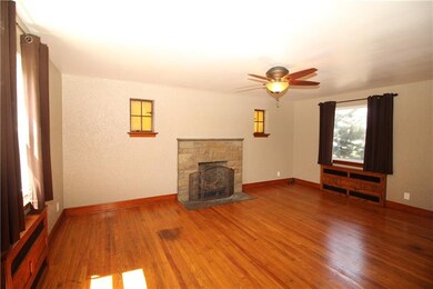 Stunning Stone Fireplace highlights Large Living R