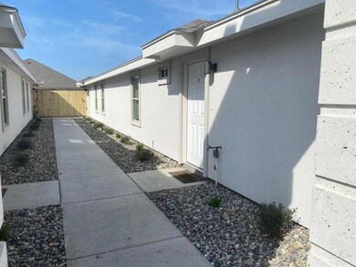 View of side of home featuring stucco siding