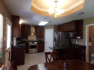 Breakfast Area & Kitchen Open to Den