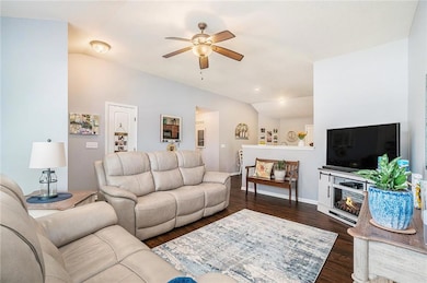Additional view of the living room, which opens to the kitchen.