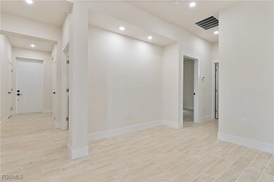 Spare room with recessed lighting and light wood-type flooring