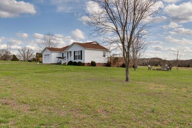 RANCH HOME HAS LARGE FRONT AND BACK YARDS WITH PARK LIKE SETTING
