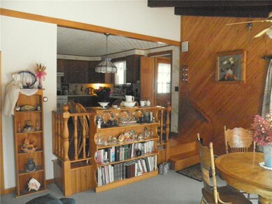 Dining area and step up to kitchen