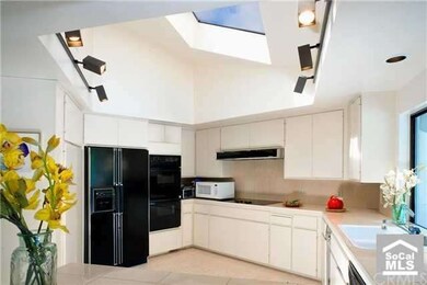 Gourmet kitchen open to family room.