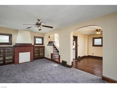 Living room with new carpet and beautiful woodwork.