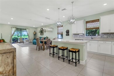 Kitchen featuring open floor plan, light counterto