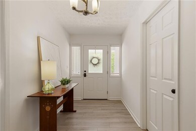 Wide front entry with dual storage closets.