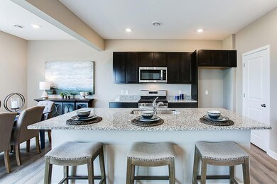 Granite counters, beautiful cabinets, and open spaces! *Model photo, selections and colors may vary!