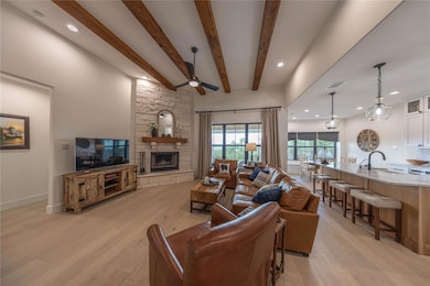 Living area featuring light wood-style floors, a 
