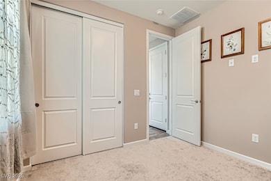 Unfurnished bedroom featuring carpet, a closet, an