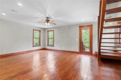 CUSTOM WOOD TRIMED WINDOWS THROUGHOUT.