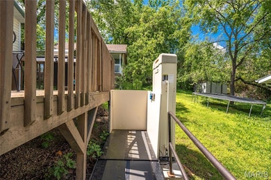 View of green lawn featuring a trampoline