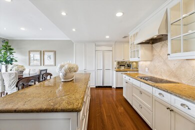 Kitchen has granite countertops, under cabinet lig