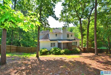 Large wooded lot with screened and open deck.